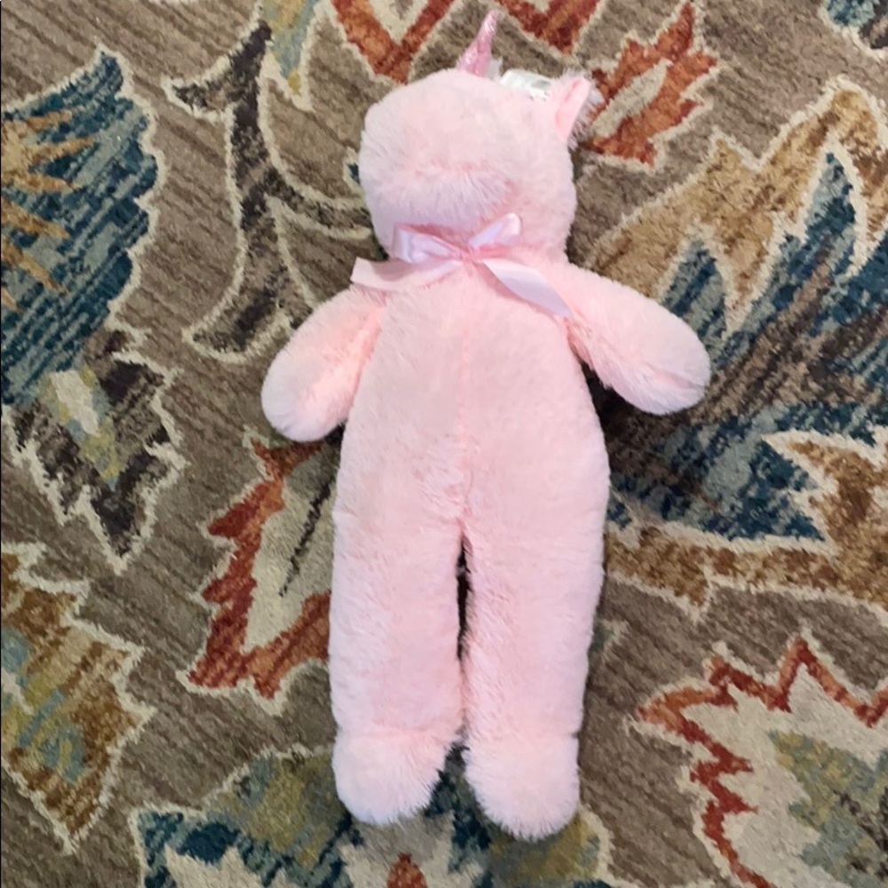 A pink stuffed unicorn.